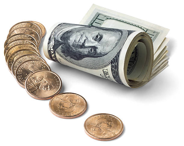 istock Roll of bills and some coins 152989150