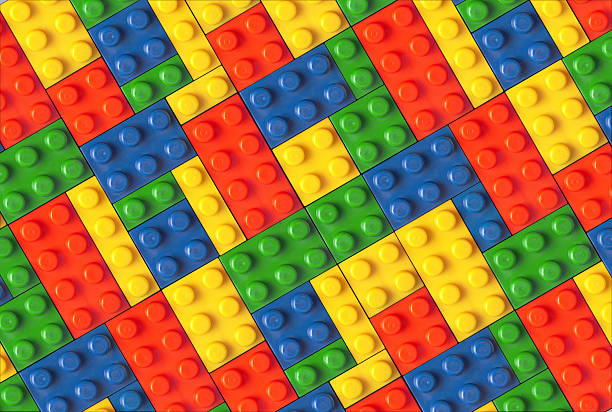 blocks in mehreren farben kombiniert werden - construction toy stock-fotos und bilder
