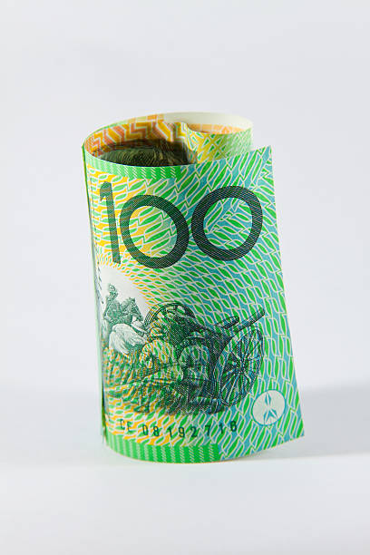 rolled up Australian 100 dollar note stock photo