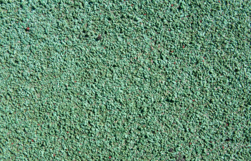 Asphalt road surface painted green