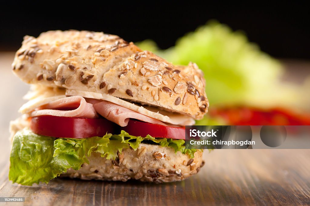 Sliced ham and cheese sandwich Sliced ham sandwich with tomatoes on a mixed seed bread Antioxidant Stock Photo