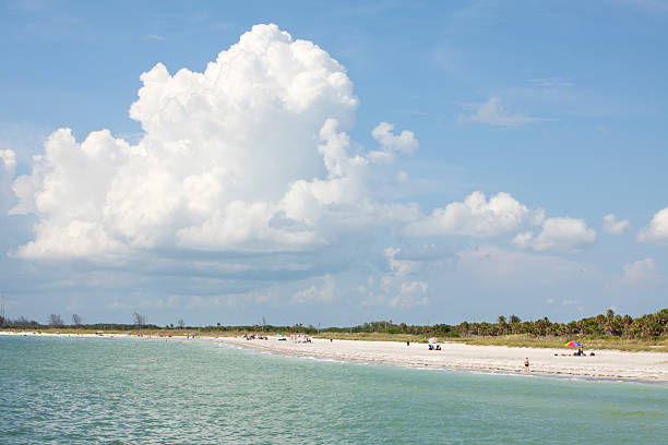istock White sandy beach and blue sky with clouds 152992616