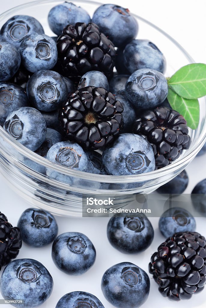 Blueberries and blackberries Glass of delicious blueberries and blackberries Berry Fruit Stock Photo