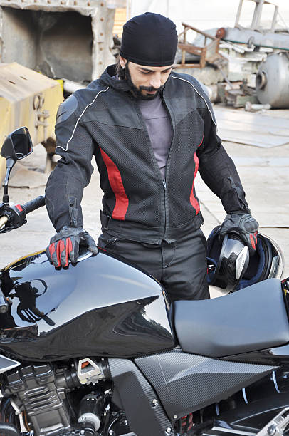 istock Biker Guy Checks Out the Bike 152992965