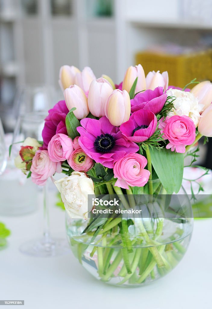 Beautiful spring flowers in a glass vase Beautiful spring flowers in a glass vase on a table Anemone Flower Stock Photo