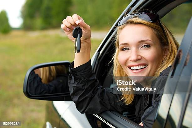 Woman In Car Showing The Keys Stock Photo - Download Image Now - 20-29 Years, Adult, Adults Only