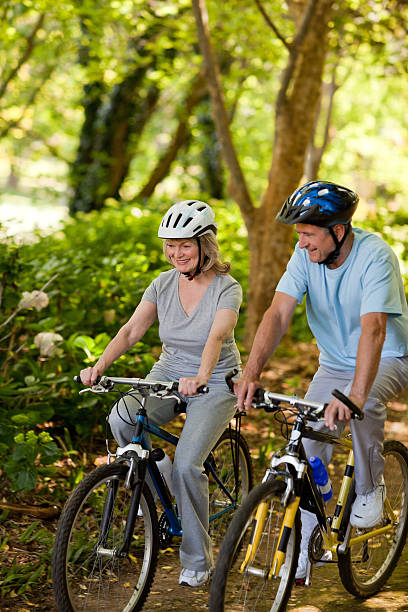 istock Elderly couple mountain biking outside 152993595