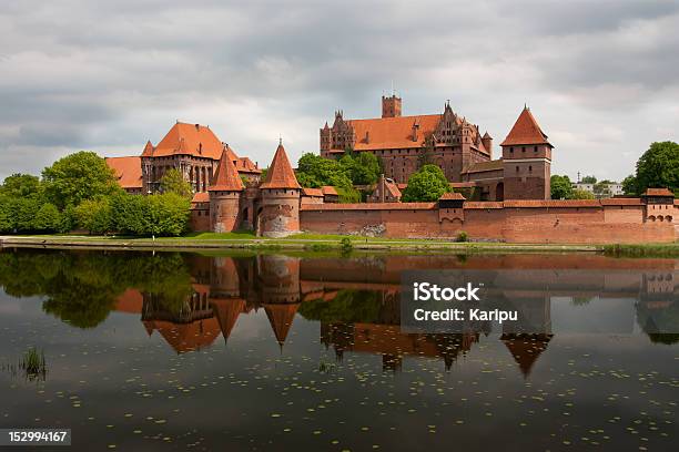 European Style Red Brick Castle With Turrets And Wall Stock Photo - Download Image Now