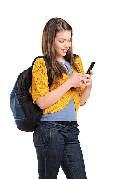 istock Teenage girl typing a text message on cellphone 152995119