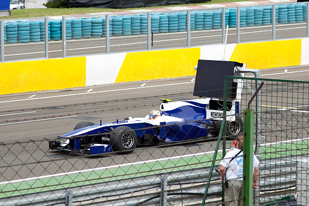 A formula 1 car on a race track stock photo