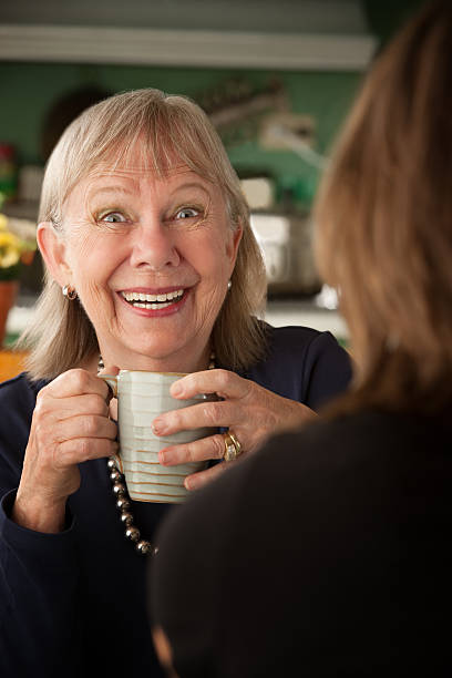 istock Senior woman in kitchen with daughter or friend 152995218