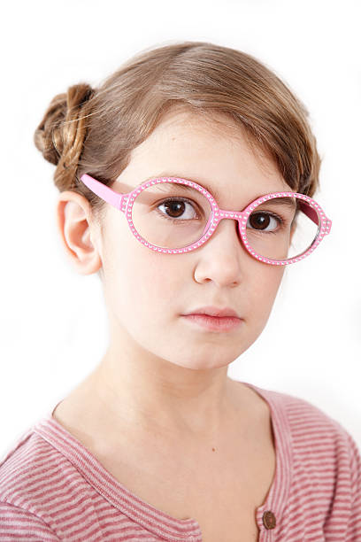 serious little girl in pink t-shirt stock photo