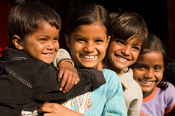 istock four Indian children hugging each other and smiling 152996217