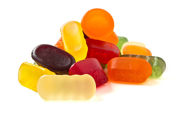 Wine Gums A selection of wine gums from low perspective isolated on white. gum drop photos stock pictures, royalty-free photos & images