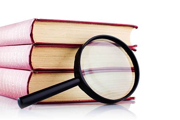 istock Old books with a loupe on white background. Isolated. 152998680