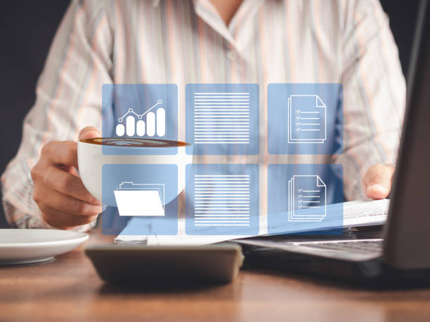 istock Businesswoman reading digital documents on a virtual screen 1529987784