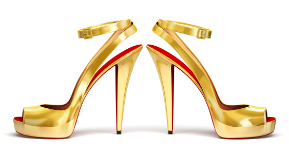 Golden High Heels isolated on white