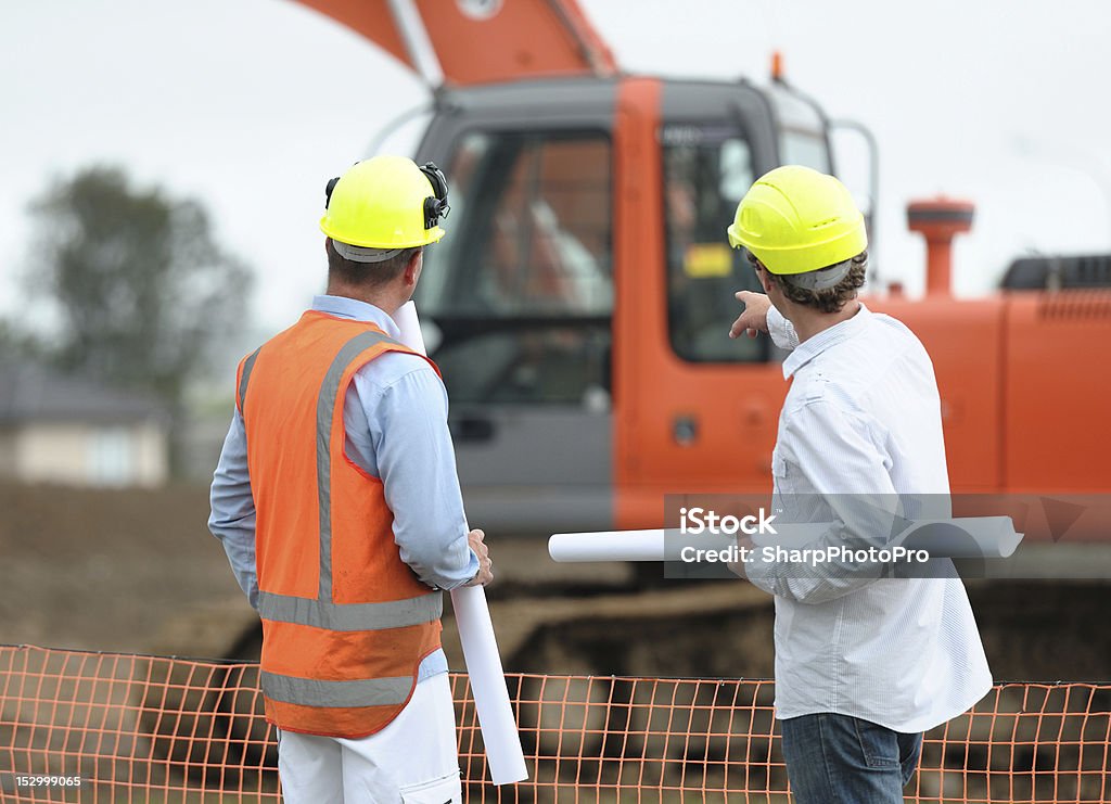On The Job Two Architects Discuss Discuss Work On A Building Site Construction Site Stock Photo