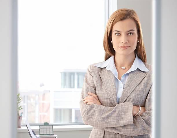 istock Confident businesswoman smiling in bright office 152999778