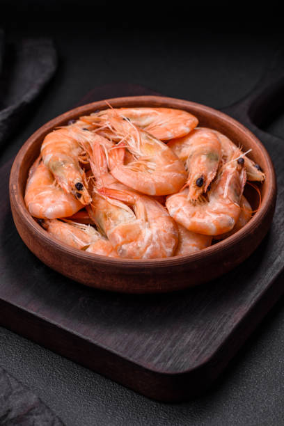 istock Delicious fresh boiled tiger prawns with salt and spices on a ceramic plate 1529997888