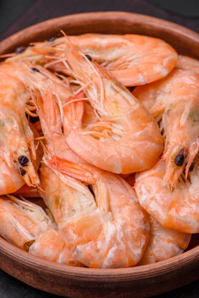 istock Delicious fresh boiled tiger prawns with salt and spices on a ceramic plate 1529999464