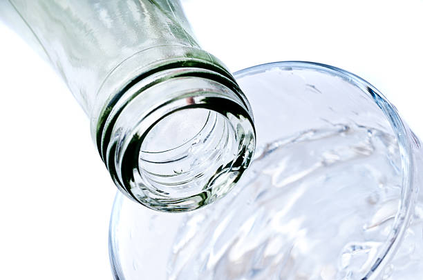 istock bottle pouring water into  glass 153000088