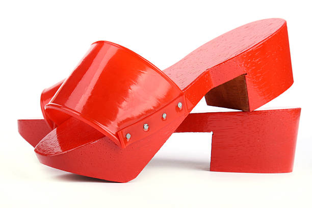 Red wooden clogs stock photo