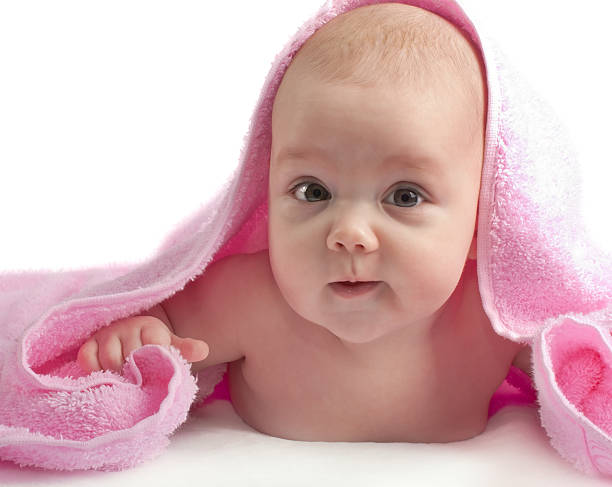 istock Cute baby with pink towel 153000565