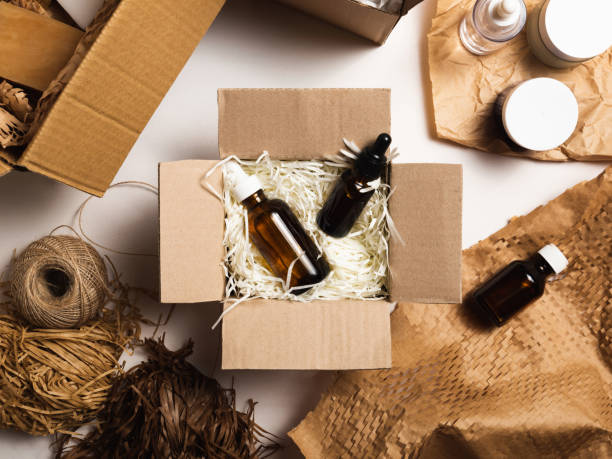 istock Beauty box with serum bottles on shredded white paper 1530007464