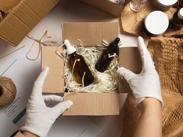 istock Beauty box with serum bottles on shredded white paper 1530007465