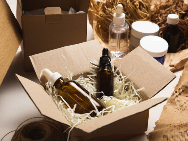 istock Beauty box with serum bottles on shredded white paper 1530007467