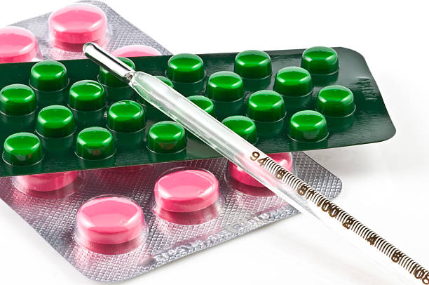 Vermelho e verde com termômetro pílulas - foto de acervo