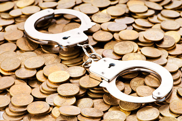 istock Hand cuffs and coins as security concept 153001118
