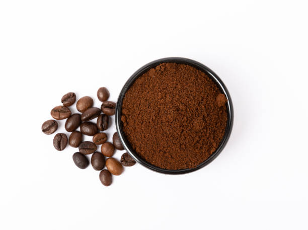 istock Ground coffee and coffee beans isolated on white background. 1530017442