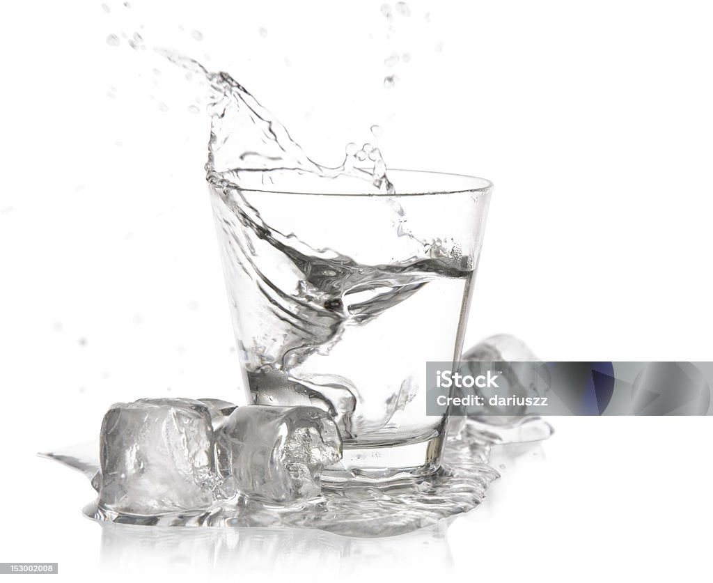 glass with splash glass of drink with splash on white Alcohol - Drink Stock Photo