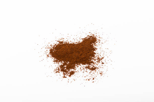 Ground coffee and coffee beans isolated on white background.