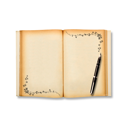 Old blank book with fountain pen, isolated on white with clipping path.