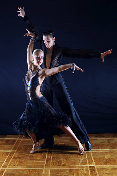 istock dancers in ballroom against black background 153003051