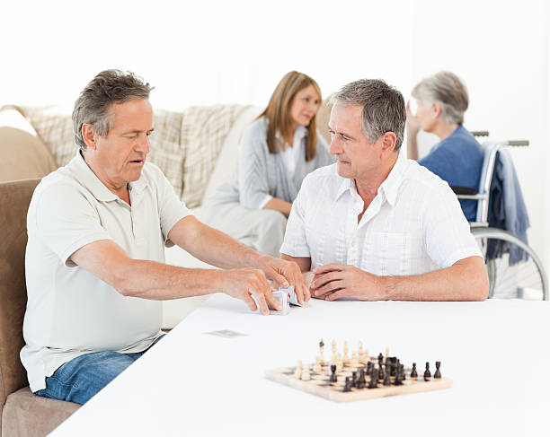 istock Men playing cards while their wifes are talking 153003058