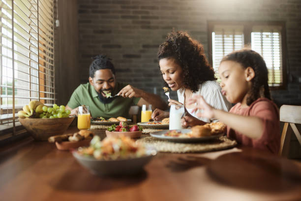 istock Young black family having breakfast at dining table. 1530031946