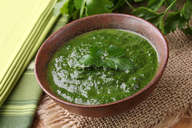 istock A bowl of spinach cream soup on a table 153003258