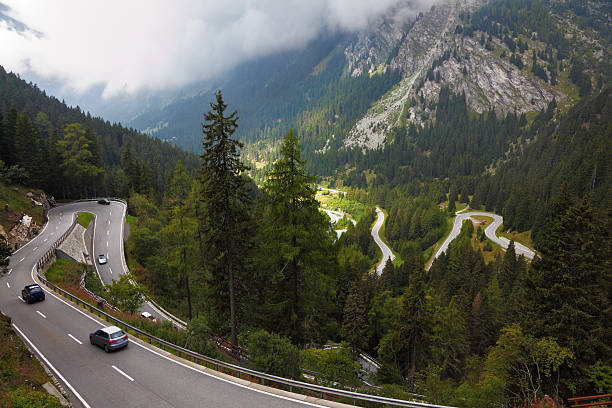 istock Cars on a steep mountain road turn 153003280