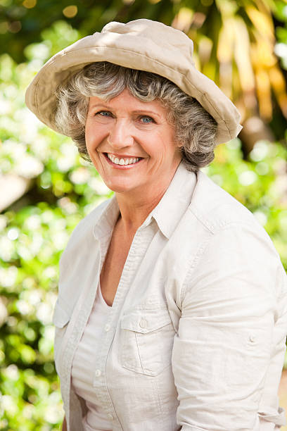 istock Pretty senior woman looking at the camera 153003347