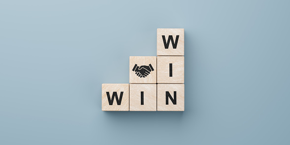 Cubes with successful deal, contract for all participants, handshake and win text. handshake icon and win-win situation