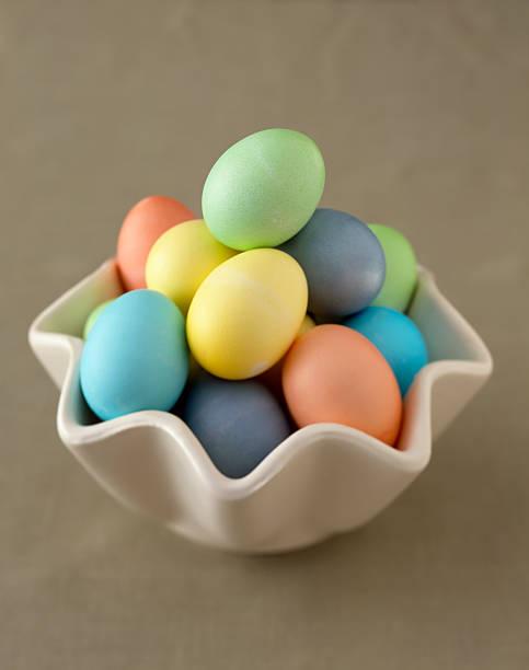 Multiple Colored Easter Eggs in a Dish stock photo