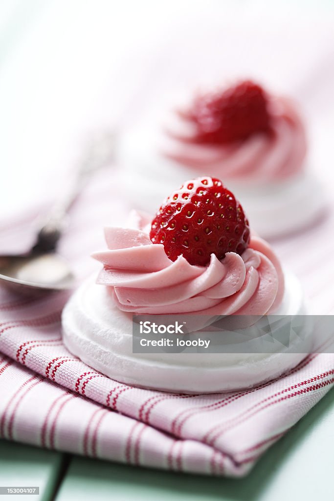 strawberry meringue pavlova meringue nests with strawberry cream and fresh strawberries Berry Fruit Stock Photo