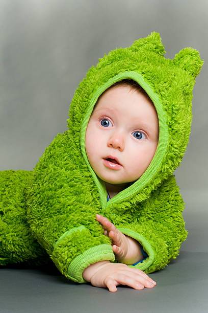istock baby in a frog outfit 153004280