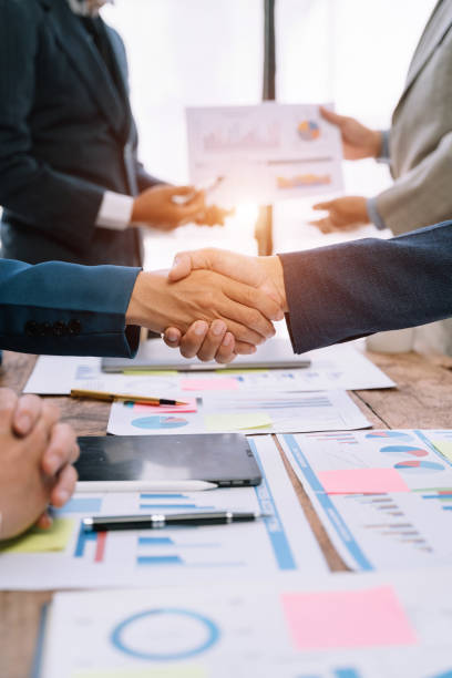 istock Businessmen shake hands after agreeing to start a new project successfully. 1530044306