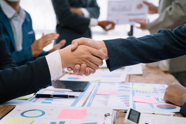 istock Businessmen shake hands after agreeing to start a new project successfully. 1530044310