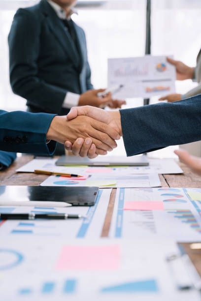 istock Businessmen shake hands after agreeing to start a new project successfully. 1530044321